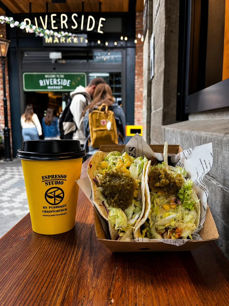 Yellow Espresso Studio cup and takeaway food outside Riverside Market